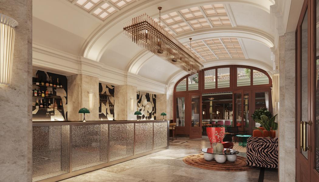 Välvda tak, rutat kassettak och en receptionsdisk i krossat glas sätter tonen redan i entrén.
Bild: Studio Ram
